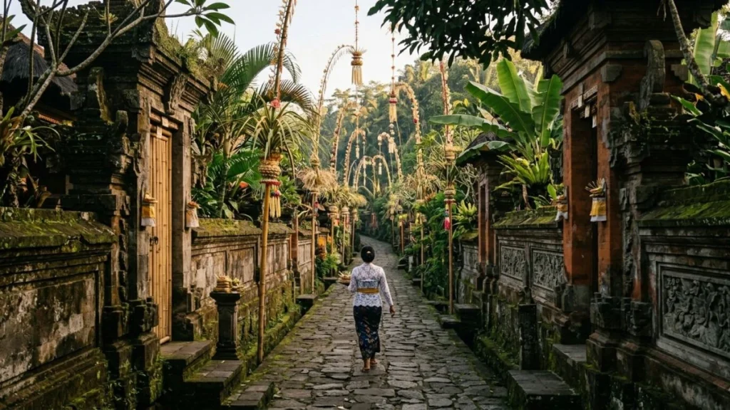 Ubud hidden villages — narrow traditional village lane with bamboo compound gates and tropical foliage, rural Ubud Bali