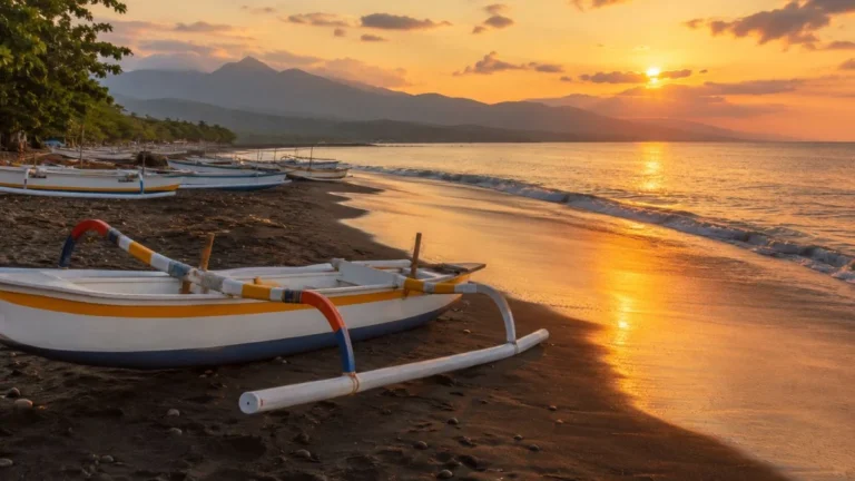 Lovina Bali black sand beach with traditional fishing boats at sunset